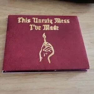 Red Album Cover with Gold Text